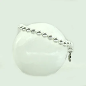 Pulsera elástica de concha perla charm